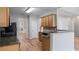 Well-lit kitchen with dark countertops and wood cabinets at 481 Jefferson Chase Se Cir, Atlanta, GA 30354