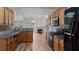 Kitchen features stainless steel appliances, wood cabinets, and granite countertops at 481 Jefferson Chase Se Cir, Atlanta, GA 30354