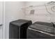 Laundry room featuring modern washer and dryer, with overhead storage for maximum convenience at 481 Jefferson Chase Se Cir, Atlanta, GA 30354