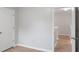 This is a room with hardwood flooring and access to other rooms and the second floor at 481 Jefferson Chase Se Cir, Atlanta, GA 30354