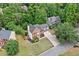 Beautiful two-story brick home with a well-manicured lawn and driveway, surrounded by lush greenery and mature trees at 5344 Saint Martins Se Ct, Mableton, GA 30126