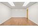 Clean, brightly lit, empty basement with wood-look floors and drop ceiling at 5344 Saint Martins Se Ct, Mableton, GA 30126