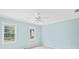 Bedroom features dual windows, a ceiling fan and pale blue walls at 5344 Saint Martins Se Ct, Mableton, GA 30126