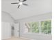 Bedroom with neutral carpet, a ceiling fan, and three large windows with blinds at 5344 Saint Martins Se Ct, Mableton, GA 30126