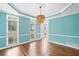 Spacious light blue dining room with hardwood floors and natural light at 5344 Saint Martins Se Ct, Mableton, GA 30126