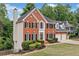 Lovely brick home with two-car garage, manicured lawn and mature trees at 5344 Saint Martins Se Ct, Mableton, GA 30126