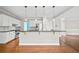 Open kitchen with white cabinets, granite countertops, stainless steel appliances, and a breakfast bar at 5344 Saint Martins Se Ct, Mableton, GA 30126