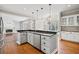 Spacious kitchen with white cabinetry, granite countertops, and an open layout into the living room at 5344 Saint Martins Se Ct, Mableton, GA 30126