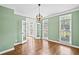 Bright, green living room featuring hardwood floors, french doors and views of the front entrance at 5344 Saint Martins Se Ct, Mableton, GA 30126