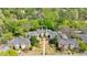 Aerial view of a brick condo building surrounded by mature trees and meticulously maintained landscaping at 115 Peachtree Memorial Nw Dr # C1, Atlanta, GA 30309