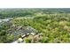 An aerial view showcasing a residential neighborhood with lush trees, a golf course, and a serene lake nearby at 115 Peachtree Memorial Nw Dr # C1, Atlanta, GA 30309