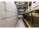 Unfinished basement with storage shelves and visible piping at 115 Peachtree Memorial Nw Dr # C1, Atlanta, GA 30309