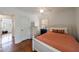 Bright bedroom with hardwood floors, ceiling fan, windows, and closet at 115 Peachtree Memorial Nw Dr # C1, Atlanta, GA 30309