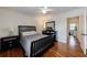 Cozy bedroom with hardwood floors, ceiling fan, neutral color palette, and stylish furniture at 115 Peachtree Memorial Nw Dr # C1, Atlanta, GA 30309