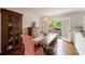 Bright dining room with hardwood floors, furniture, and a light fixture at 115 Peachtree Memorial Nw Dr # C1, Atlanta, GA 30309