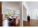 Bright dining room features access to a private balcony and hardwood floors at 115 Peachtree Memorial Nw Dr # C1, Atlanta, GA 30309