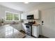 Kitchen featuring granite countertops, stainless steel appliances, and white cabinetry at 115 Peachtree Memorial Nw Dr # C1, Atlanta, GA 30309