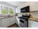 The kitchen features granite countertops, and stainless steel appliances and fixtures at 115 Peachtree Memorial Nw Dr # C1, Atlanta, GA 30309