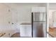 Kitchen featuring granite countertops, a stainless steel refrigerator and ample cabinet space at 115 Peachtree Memorial Nw Dr # C1, Atlanta, GA 30309