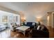 Living room featuring hardwood floors, a bay window, and a comfortable seating area at 115 Peachtree Memorial Nw Dr # C1, Atlanta, GA 30309