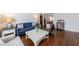 Spacious living room boasting hardwood floors, ample seating, and stylish decor for comfortable living at 115 Peachtree Memorial Nw Dr # C1, Atlanta, GA 30309