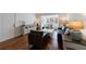 Cozy living room with hardwood floors, comfortable seating, and bright, natural light from large windows at 115 Peachtree Memorial Nw Dr # C1, Atlanta, GA 30309