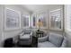 Bright sunroom with shuttered windows, comfortable chairs, and neutral decor offering a relaxing retreat at 115 Peachtree Memorial Nw Dr # C1, Atlanta, GA 30309