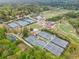 An expansive aerial view capturing several tennis courts alongside a lush green golf course for recreation at 115 Peachtree Memorial Nw Dr # C1, Atlanta, GA 30309