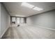 Spacious basement with gray carpet and multiple windows for natural light at 135 Greenmont Downs Trce, Alpharetta, GA 30009