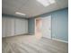 Bedroom with gray carpet, blue accent wall, and ample closet space at 135 Greenmont Downs Trce, Alpharetta, GA 30009