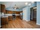 This spacious kitchen features wood cabinets, stainless steel appliances, and stylish hardwood floors at 135 Greenmont Downs Trce, Alpharetta, GA 30009