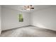 Bright bedroom features neutral paint, plush carpet, and a ceiling fan at 3070 Branford Ct, Marietta, GA 30062