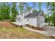 Exterior home view with large deck, attached garage, and landscaped backyard at 3070 Branford Ct, Marietta, GA 30062