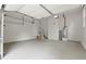 Spacious, clean garage with stairs, neutral colors, and an installed water heater at 3070 Branford Ct, Marietta, GA 30062