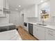 Modern kitchen featuring stainless steel appliances, white cabinets and granite countertops at 3070 Branford Ct, Marietta, GA 30062