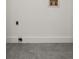 Clean and well-lit unfinished room showcases gray tile floors, minimal detailing, and neutral white walls at 3070 Branford Ct, Marietta, GA 30062