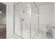 Bathroom featuring a large glass walk-in shower with white marble tile and a rainfall showerhead at 3070 Branford Ct, Marietta, GA 30062