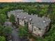 Aerial shot of an apartment complex surrounded by trees, offering a scenic view and convenient parking at 5559 Glenridge Dr # 1103, Sandy Springs, GA 30342