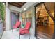 Outdoor patio with view into kitchen, complete with chairs and small table, creating an inviting and functional area at 5559 Glenridge Dr # 1103, Sandy Springs, GA 30342