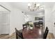 Lovely dining room with a decorative chandelier and an open-concept view of the kitchen and living room at 5559 Glenridge Dr # 1103, Sandy Springs, GA 30342