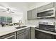 Modern kitchen featuring white quartz countertops, subway tile backsplash, and stainless steel appliances at 5559 Glenridge Dr # 1103, Sandy Springs, GA 30342