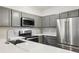 Gorgeous kitchen features quartz countertops, subway tile backsplash, and stainless steel appliances at 5559 Glenridge Dr # 1103, Sandy Springs, GA 30342