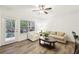 Bright living room featuring wood floors, neutral furniture, and natural light, perfect for modern comfort at 5559 Glenridge Dr # 1103, Sandy Springs, GA 30342
