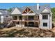 Back of house, featuring a two-story deck and well-maintained lawn at 71 Ramey Rd, Sugar Hill, GA 30518