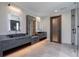 Sleek bathroom featuring double vanities, modern fixtures, and a glass-enclosed shower at 71 Ramey Rd, Sugar Hill, GA 30518