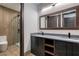 Bathroom featuring double vanity with granite countertop and modern fixtures at 71 Ramey Rd, Sugar Hill, GA 30518
