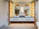 Elegant bathroom with dual vanities, modern fixtures, and custom-lit storage on both sides at 71 Ramey Rd, Sugar Hill, GA 30518
