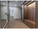 Hallway featuring wood-look accent wall with coat hooks and bench at 71 Ramey Rd, Sugar Hill, GA 30518