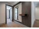Hallway with wooden floors, decorative mirror, and minimalist design at 71 Ramey Rd, Sugar Hill, GA 30518