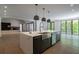 Open kitchen featuring a large island, stainless steel appliances, and seamless access to living area at 71 Ramey Rd, Sugar Hill, GA 30518